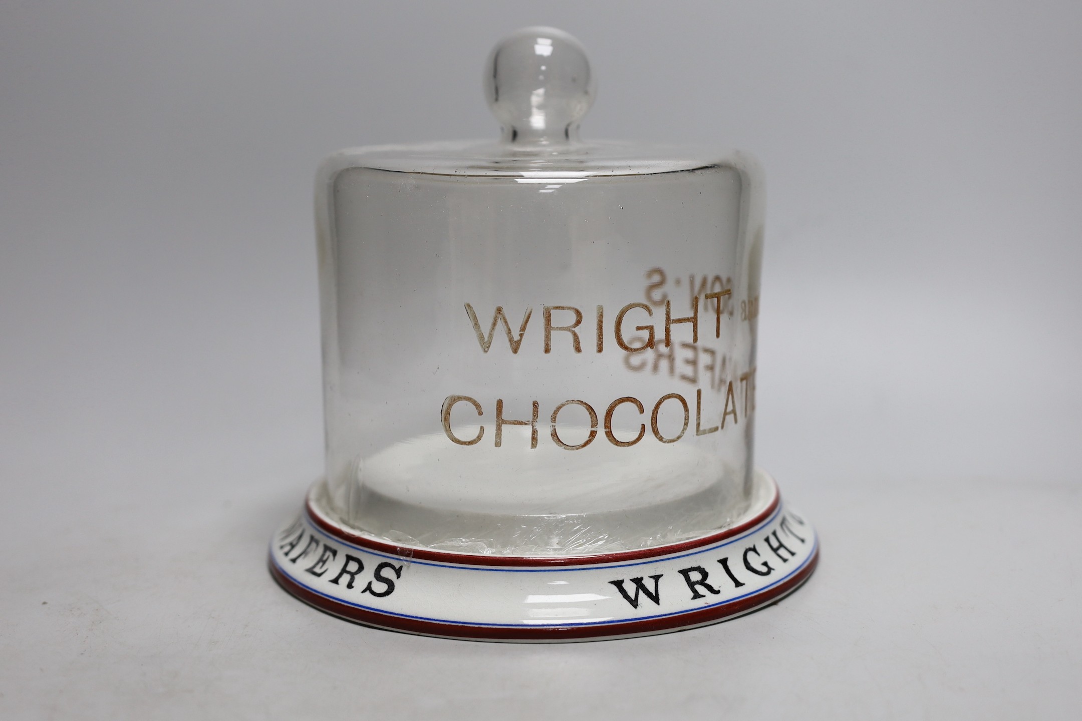 A Wright & Son’s Wafers display pottery stand with glass dome. 19cm tall overall